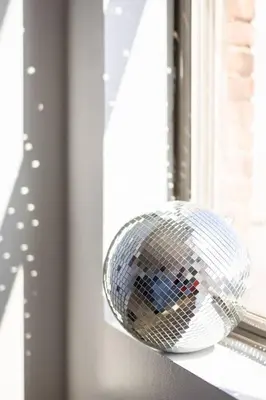 a disco ball is sitting on a window sill at Cleveland Loft/Wolstein/Progressive/Playhouse/CSU in Cleveland