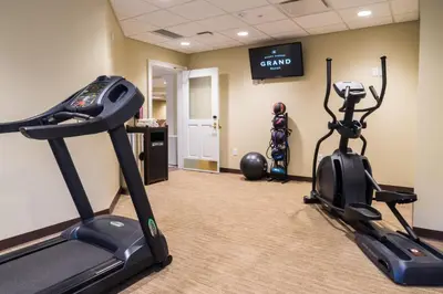 a gym with two exercise bikes in a room at The Mount Vernon Grand Hotel in Mount Vernon