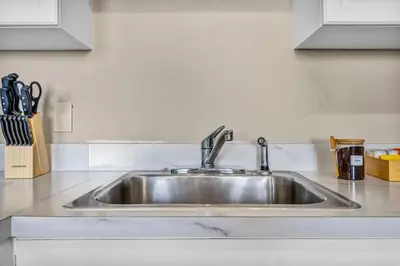 a stainless steel sink in a kitchen at Colorful 2Bed Apt Heart of Downtown Lake Views in Cleveland