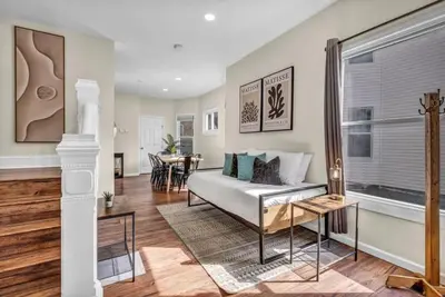 a living room with a couch and a table at BIG 4BR House 7 Mins to Downtown with Foosball and Games in Cleveland
