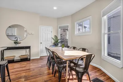 a dining room with a table and chairs at BIG 4BR House 7 Mins to Downtown with Foosball and Games in Cleveland