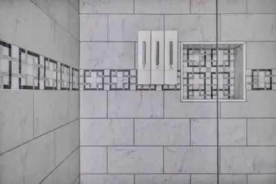 a bathroom with white tile walls and mirrors at BIG 4BR House 7 Mins to Downtown with Foosball and Games in Cleveland