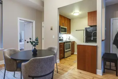 a kitchen with a table and chairs in a room at Walkable Condo Near Over-the-Rhine and Hard Rock! in Cincinnati