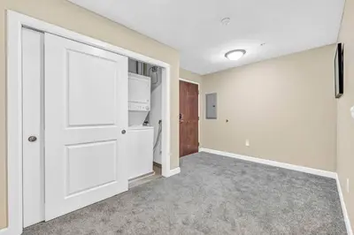 an empty room with a closet and a door at LAKE VIEW Sky-Suite in the Heart of Downtown! in Cleveland