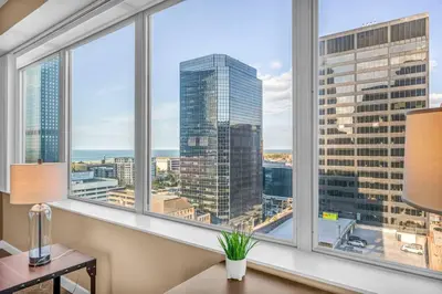a view of a city from a room with windows at LAKE VIEW Sky-Suite in the Heart of Downtown! in Cleveland