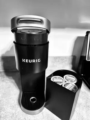 a black and white photo of a keurric cup and a box at Premier 3BR Retreat - CVNP, Blossom & Boston Hills in Cuyahoga Falls