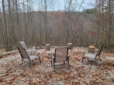 three chairs sitting in a pile of leaves at Queen of Hearts in Rockbridge