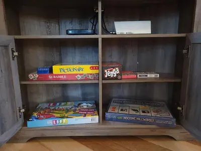a book shelf filled with lots of books at Queen of Hearts in Rockbridge