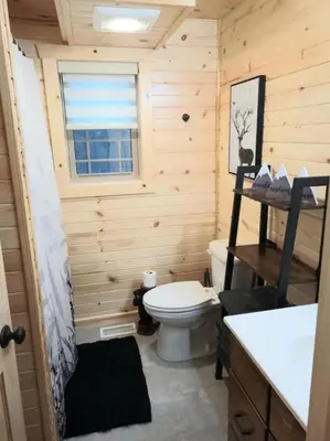 a small bathroom with a toilet and a window at Queen of Hearts in Rockbridge