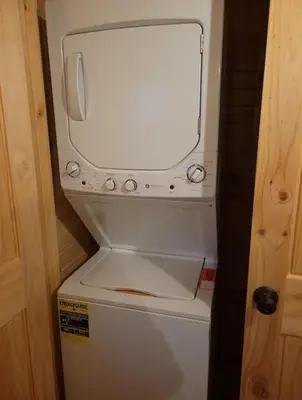 a white refrigerator with a mirror on top of it at Queen of Hearts in Rockbridge