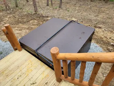 a briefcase sitting on top of a wooden bench at Jack of Hearts in Rockbridge