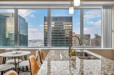 a kitchen with a view of a city at Downtown Suite w/ Amazing Views in Cleveland