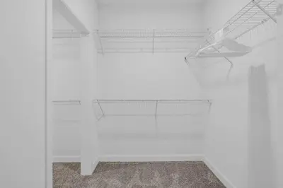 a white room with a white wall and a rug at Modern High-Rise Condo in Central Downtown | Gym in Cleveland