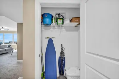 a room with a door with a surfboard in it at 21st Floor Penthouse | Amazing Views of Downtown! in Cleveland