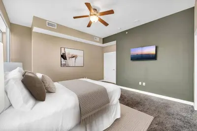 a bedroom with a bed and a ceiling fan at Sky High Suite Downtown w/ Parking Available $ in Cleveland