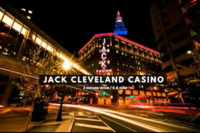 a building with a sign that reads jackpayer island casino at night at Modern Condo w/ Cathedral Views in Great Location in Cleveland