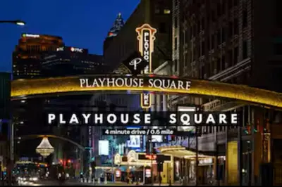 a playhouse square sign on the side of a building at Modern Condo w/ Cathedral Views in Great Location in Cleveland