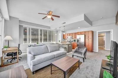 a living room with a couch and a table at Luxury High-rise Condo w/ Views! Heart of Downtown in Cleveland