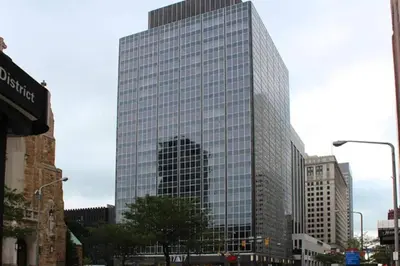a tall building with many windows in a city at Cityview Escape • Stylish 1BR+Gym & Parking $ in Cleveland