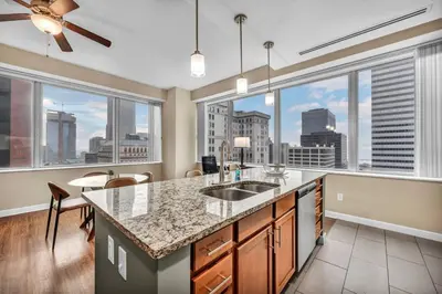 a kitchen with a large window with a view of the city at Luxury High-Rise w/ City View | Paid Parking | Gym in Cleveland