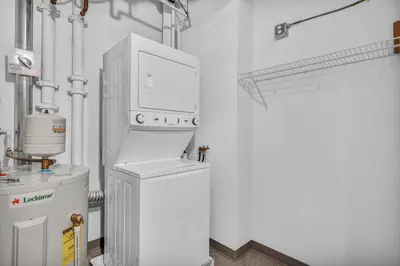 a room with a boiler and a machine in it at Luxury 13th Floor Condo: Downtown/ Parking $ /Gym in Cleveland