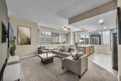 a living room with a couch and a table at Luxury 13th Floor Condo: Downtown/ Parking $ /Gym in Cleveland