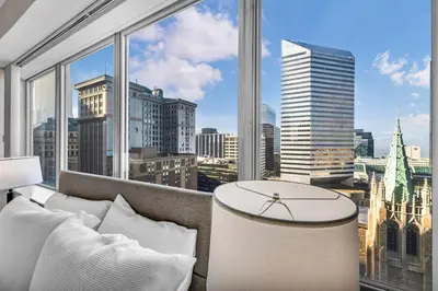 a large window with a view of a city at 14th Floor Lux Downtown Condo w/ LAKE VIEWS & Gym in Cleveland