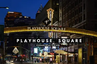 a play house square sign on a building in a city at 16th Floor Downtown High-Rise | Paid Parking & Gym in Cleveland