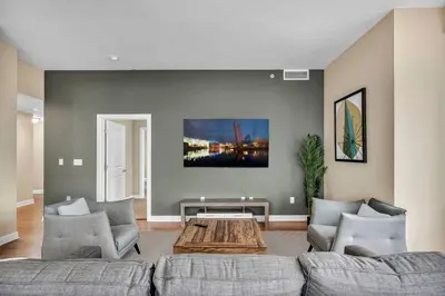 a living room with a couch and a coffee table at 16th Floor Downtown High-Rise | Paid Parking & Gym in Cleveland