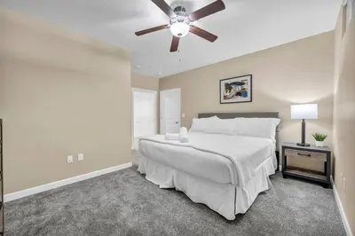 a bedroom with a bed and a ceiling fan at Luxury High-Rise • 18th Floor Condo • Parking $ in Cleveland