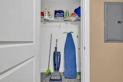 a refrigerator with cleaning items in it at Luxury High-Rise • 18th Floor Condo • Parking $ in Cleveland