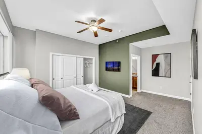 a bedroom with a bed and a ceiling fan at Luxury 21st Floor Penthouse | Great Downtown VIEWS in Cleveland