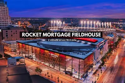 a night view of a rockett mortgage healthcare building at LAKE VIEW SkyTower Suite: Downtown ~ King Bed in Cleveland