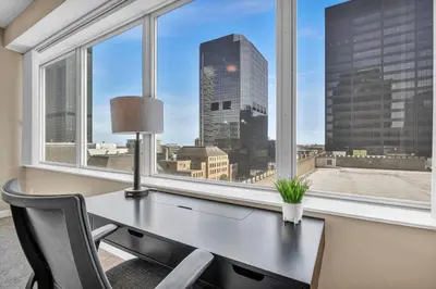 an office with a desk and a window with a view at LAKE VIEW SkyTower Suite: Downtown ~ King Bed in Cleveland
