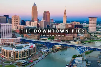 a view of a city with a bridge over a river at Playhouse Square Condo | Parking | Downtown in Cleveland