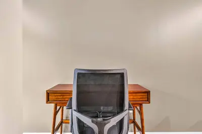 a tv sitting on a chair next to a desk at HUGE Luxe Downtown Flat: Pool Table & Parking in Cleveland