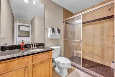 a bathroom with a shower and a toilet and a sink at Comfy City Vibe • Walk to Theaters + Parking $ in Cleveland