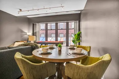 a dining room with a table and chairs at Play & Stay Loft Central, Comfy, Parking in Cleveland