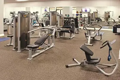 a gym with lots of cardio equipment and exercise bikes at The Playhouse Suites 2BD | Downtown | Security in Cleveland
