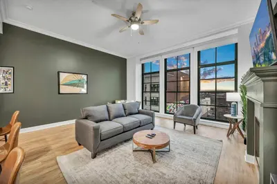 a living room with a couch and a table at Stunning Luxury Downtown Condo in Playhouse Square in Cleveland