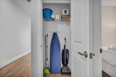 a room with a door with a surfboard in it at Stunning Luxury Downtown Condo in Playhouse Square in Cleveland