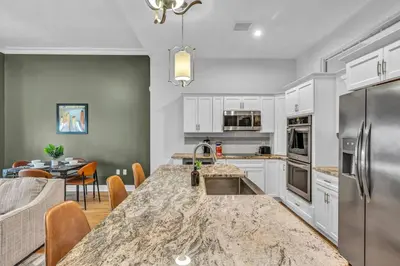 a kitchen with a table and a dining room at Ultra Chic Condo in The Heart of Downtown! in Cleveland