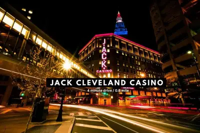 a street sign in front of a building at night at Ultra Chic Condo in The Heart of Downtown! in Cleveland
