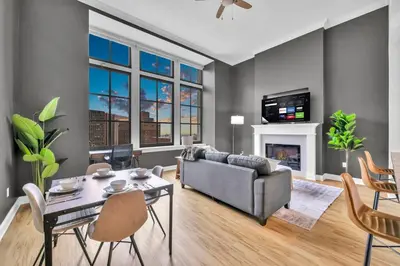 a living room with a couch and a table at Premium Luxury Condo | Playhouse SQ | Parking $ in Cleveland