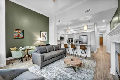 a living room with a couch and a table at Luxury Condo in Playhouse Square: Walkers Paradise in Cleveland