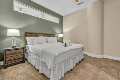 a large bedroom with a large bed with a large window at The Halle Downtown 2BD | Parking/Gym/Security in Cleveland