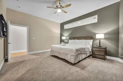a bedroom with a bed and a ceiling fan at The Halle Downtown 1BD | Parking/Gym/Security in Cleveland