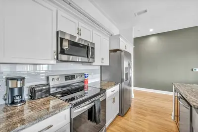 a kitchen with a stove and a microwave at The Halle Downtown | Parking/Gym/Security A2 in Cleveland