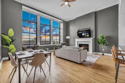 a living room with a couch and a table at The Halle Downtown | Parking/Gym/Security A2 in Cleveland