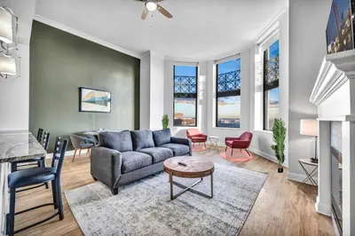 a living room with a couch and a table at HUGE Luxury Flat in Playhouse Square | Downtown in Cleveland